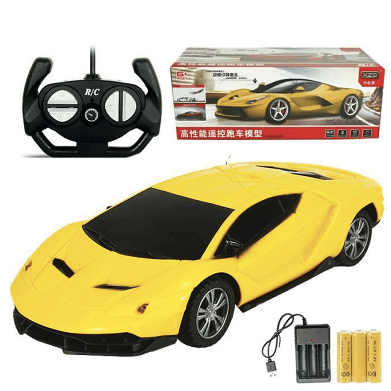 Photo d'une voiture télécommandé Lamborghini jaune avec sa boite, la télécommande et la batterie.