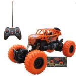 Photo d'une voiture de conduite d'escalade Jeep télécommandée orange avec sa boite et sa télécommande.