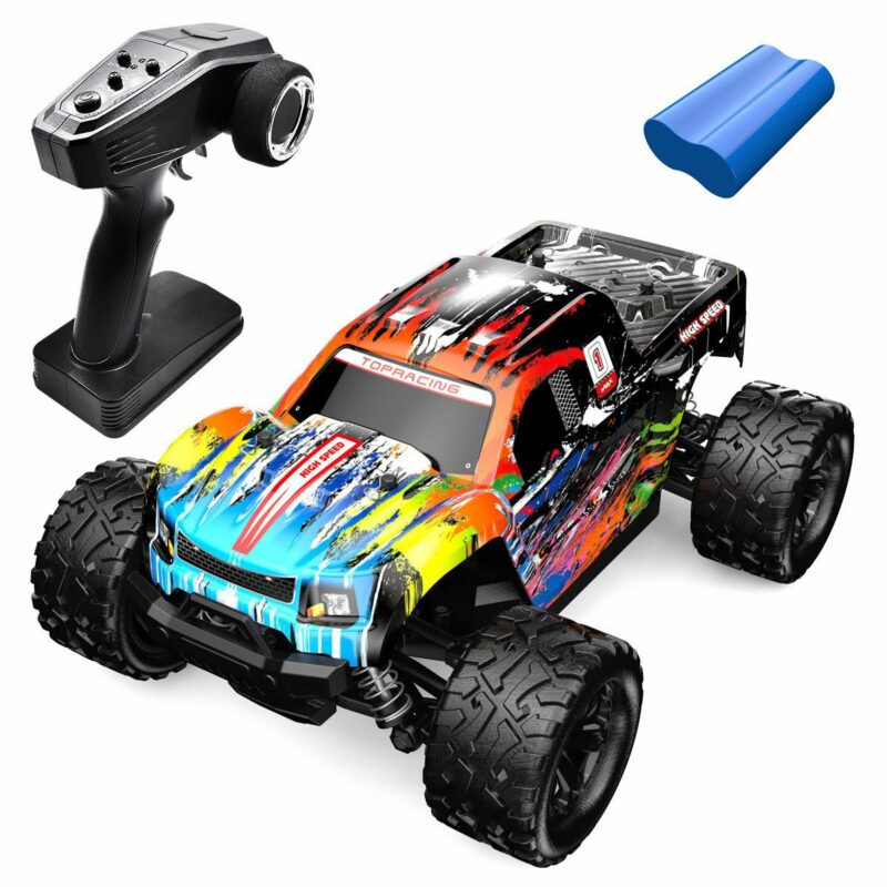 Voiture de course 4x4 télécommandée multicolore avec sa manette et sa batterie.